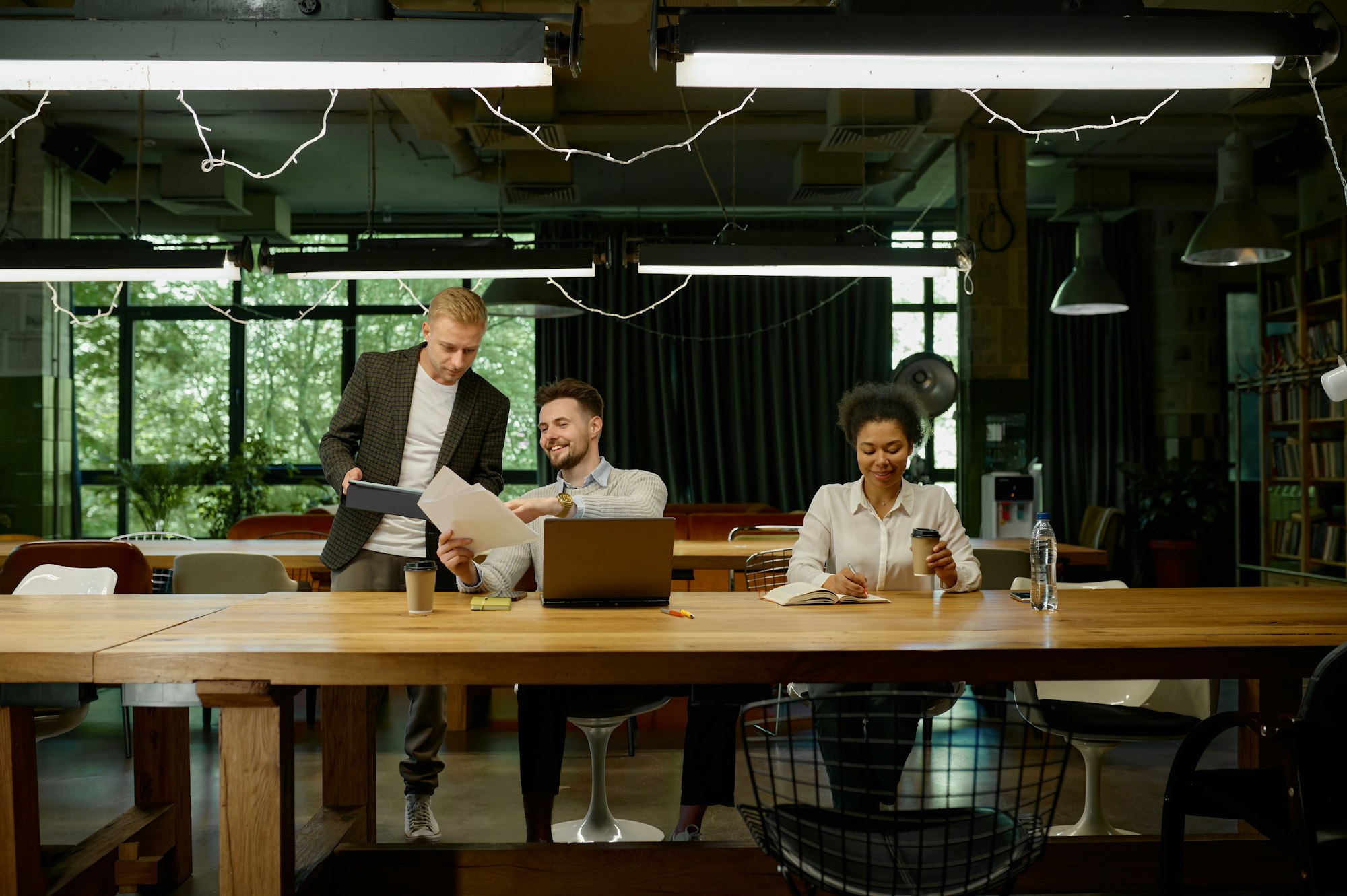 business team talking working together at coworking office open space